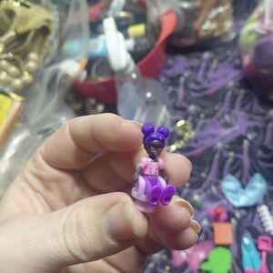 Polly Poket Girl With Purple Hair And Boots Sitting In Purple Chair